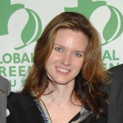 She is posing for the camera in the picture.